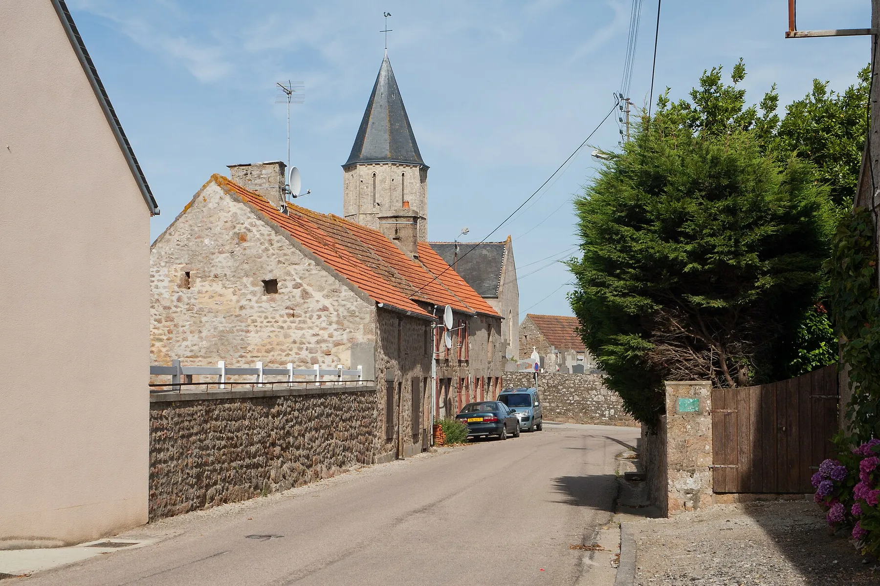 Street in Cosqueville leading to the church, looking north-east.