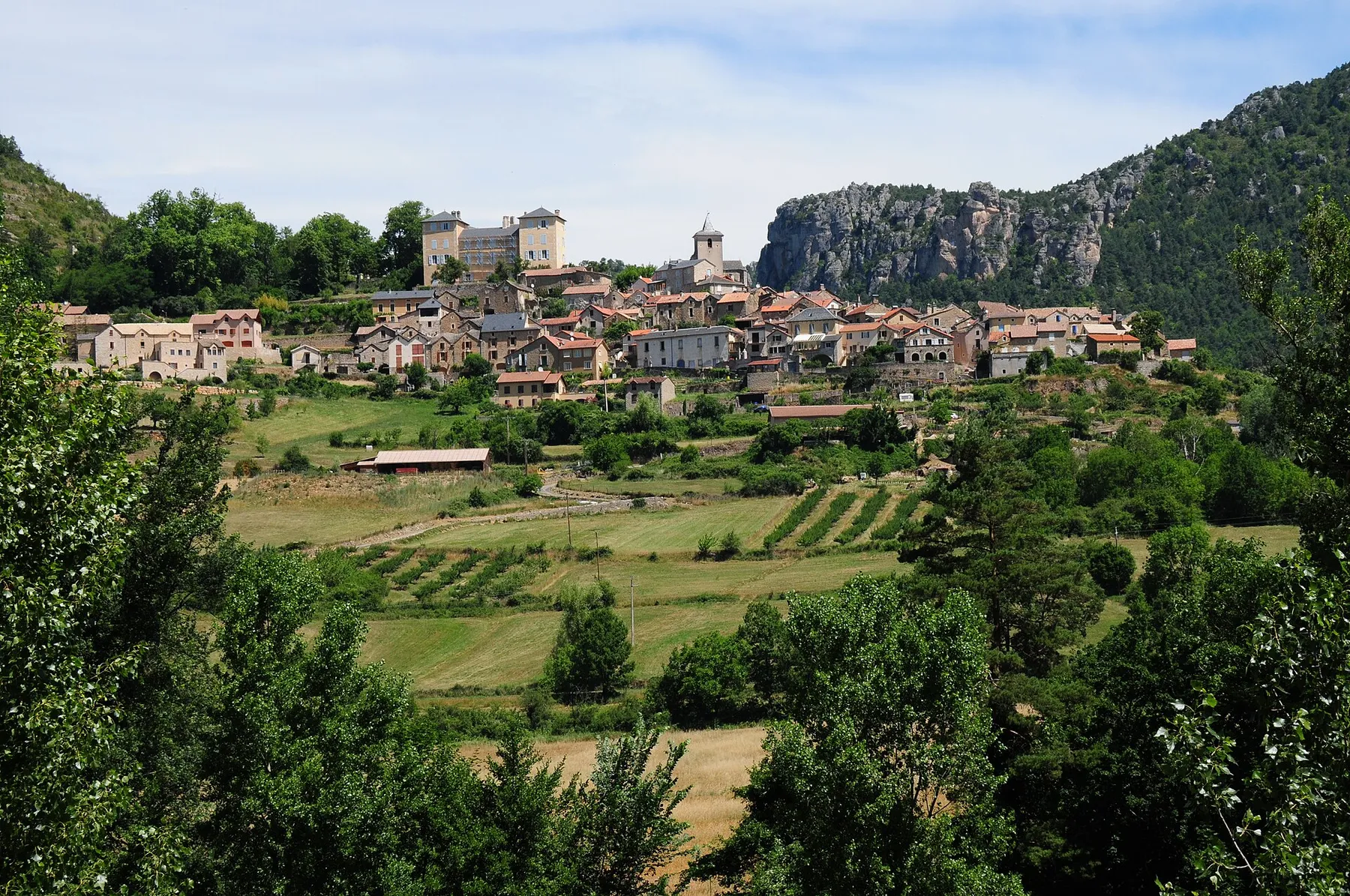 Village of Mostuejouls with church and castle